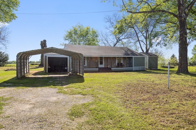 exterior space with a carport, a shingled roof, a front lawn, and dirt driveway