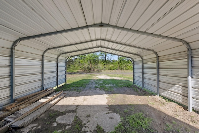 view of parking with a detached carport
