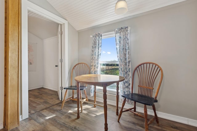 dining space with baseboards, wood finished floors, and lofted ceiling