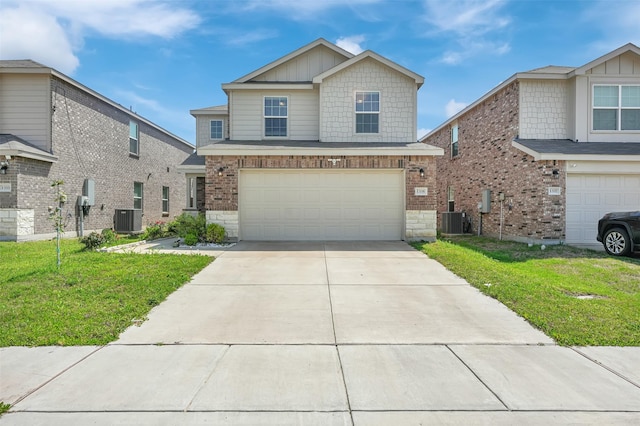1335 Panorama Dr, Forney, TX 75126 - view of front of home with cooling unit, a front yard, stone siding, a garage, and driveway
