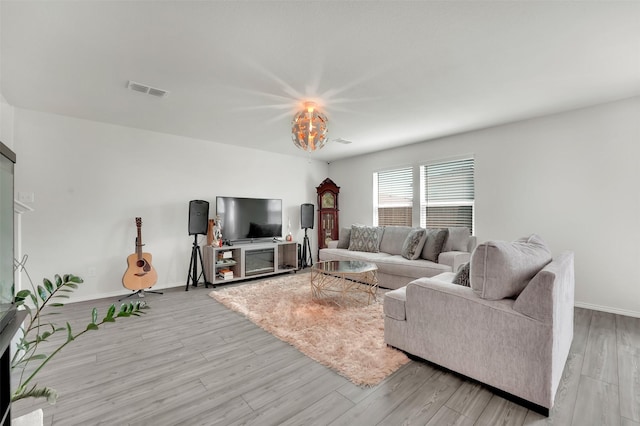 1335 Panorama Dr, Forney, TX 75126 - living room featuring light wood finished floors, baseboards, and visible vents
