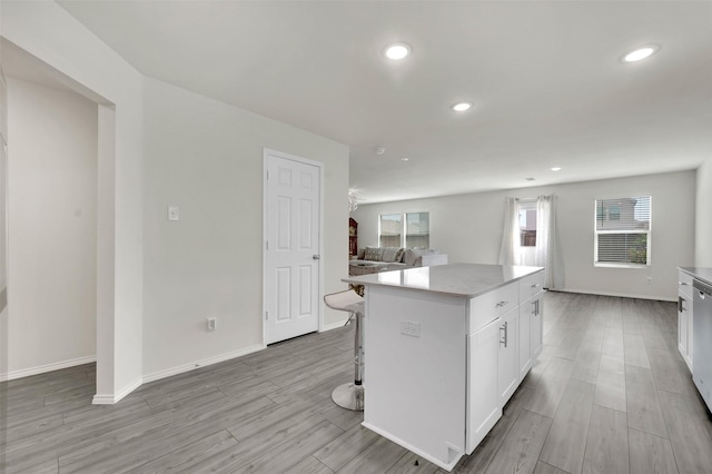 1335 Panorama Dr, Forney, TX 75126 - kitchen featuring open floor plan, a center island, a healthy amount of sunlight, and white cabinetry