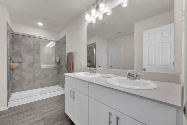 1335 Panorama Dr, Forney, TX 75126 - full bathroom featuring a sink, visible vents, double vanity, and a stall shower