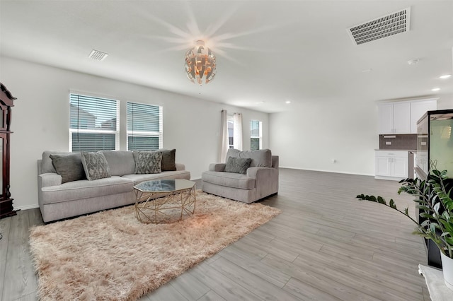 1335 Panorama Dr, Forney, TX 75126 - living room featuring baseboards, wood finished floors, and visible vents