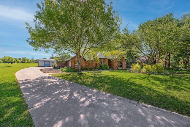 6 Broadmoor Way, Lucas, TX 75098 - view of front facade featuring a front lawn, concrete driveway, and brick siding