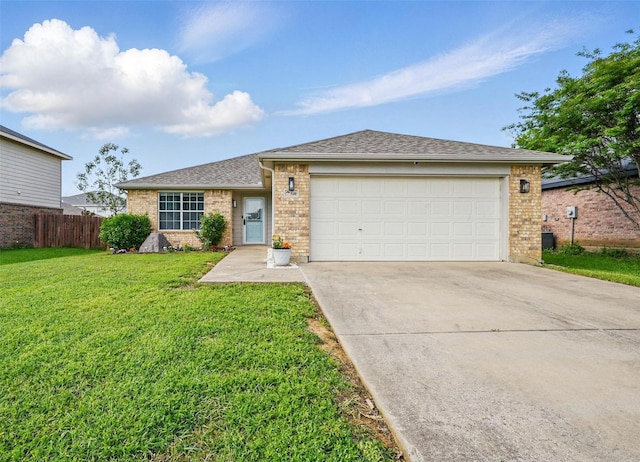 single story home featuring a front yard, a garage, brick siding, fence, and concrete driveway