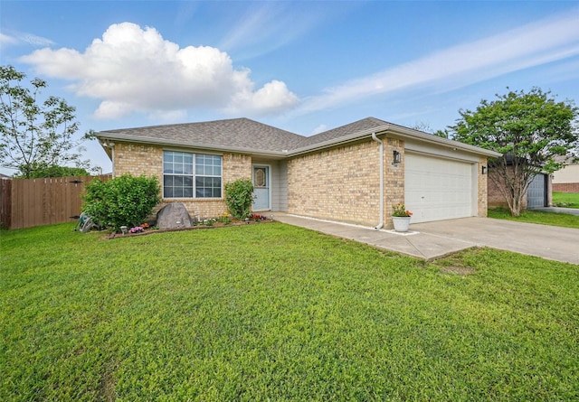 single story home featuring fence, a front yard, brick siding, concrete driveway, and an attached garage