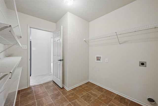 clothes washing area with washer hookup, baseboards, laundry area, and electric dryer hookup