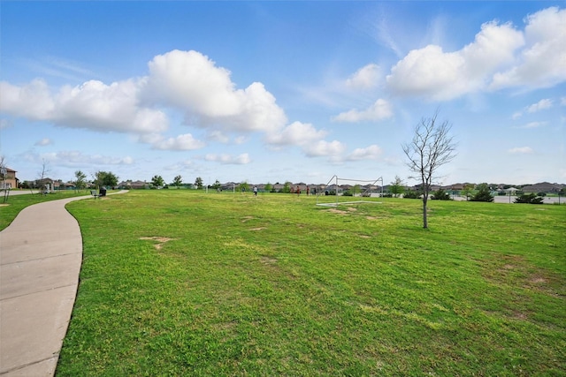 view of home's community with a lawn