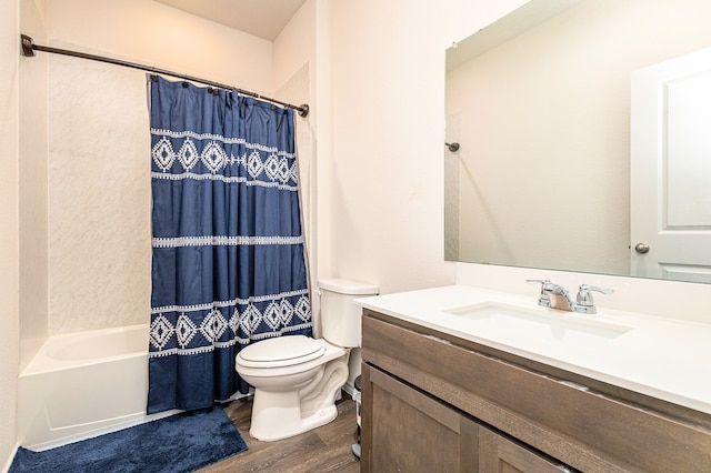 full bath featuring toilet, shower / tub combo with curtain, vanity, and wood finished floors