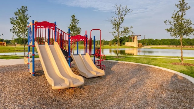 communal playground with a lawn and a water view