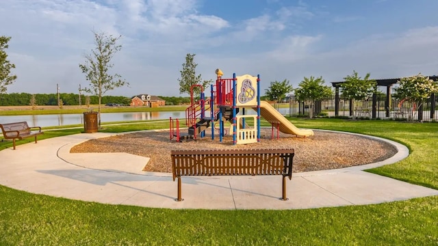 community play area featuring a lawn and a water view