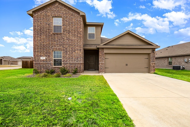 traditional-style home featuring brick siding, a front yard, and a garage