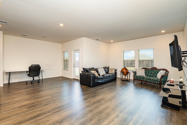 living room featuring dark wood finished floors, baseboards, visible vents, and recessed lighting
