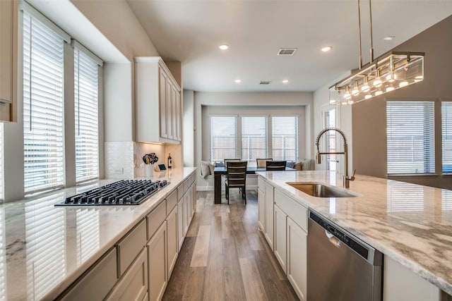 1314 Middleton Dr, Rockwall, TX 75087 - kitchen with a sink, light wood-type flooring, visible vents, dishwasher, and gas stovetop