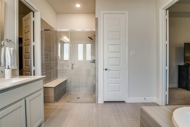 1314 Middleton Dr, Rockwall, TX 75087 - full bathroom with vanity, tile patterned flooring, recessed lighting, a stall shower, and baseboards