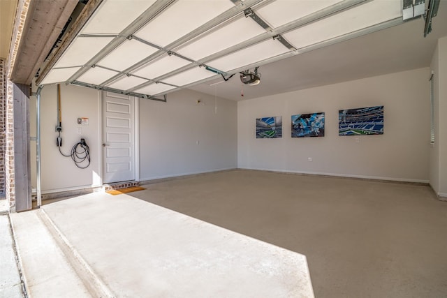 1314 Middleton Dr, Rockwall, TX 75087 - garage featuring a garage door opener and baseboards