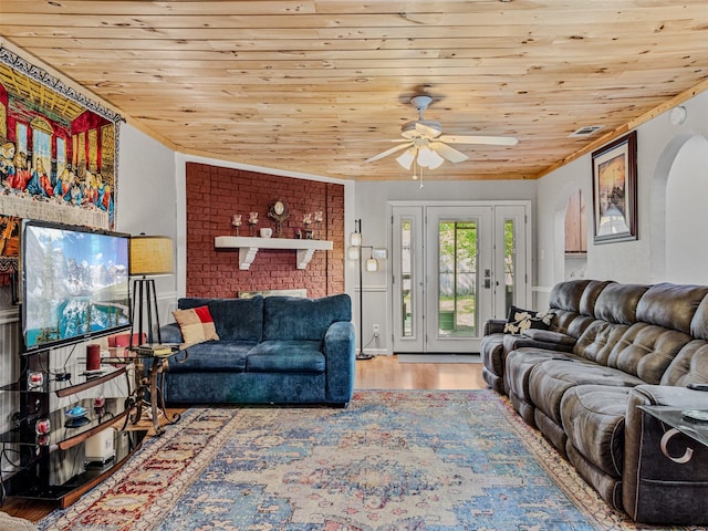 living room with wood ceiling, arched walkways, and ceiling fan