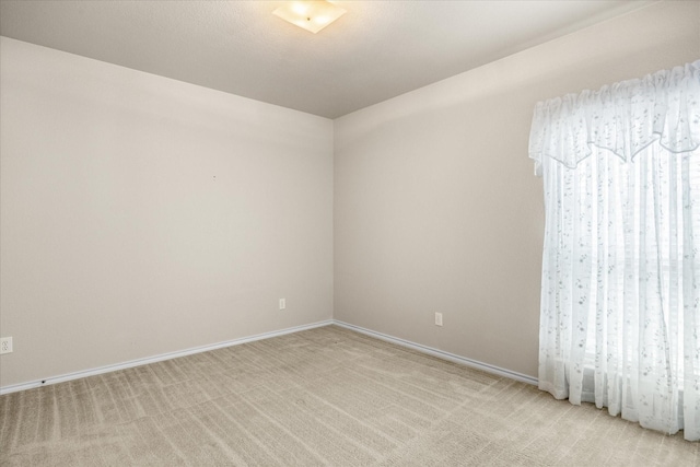 1509 Salado Trl, Weatherford, TX 76087 - empty room featuring baseboards and light colored carpet