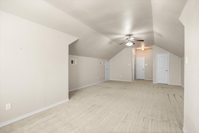 1509 Salado Trl, Weatherford, TX 76087 - additional living space with visible vents, baseboards, light colored carpet, a ceiling fan, and vaulted ceiling