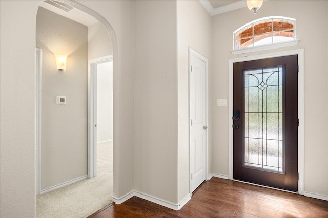 1509 Salado Trl, Weatherford, TX 76087 - entryway featuring visible vents, arched walkways, dark wood-style flooring, and baseboards