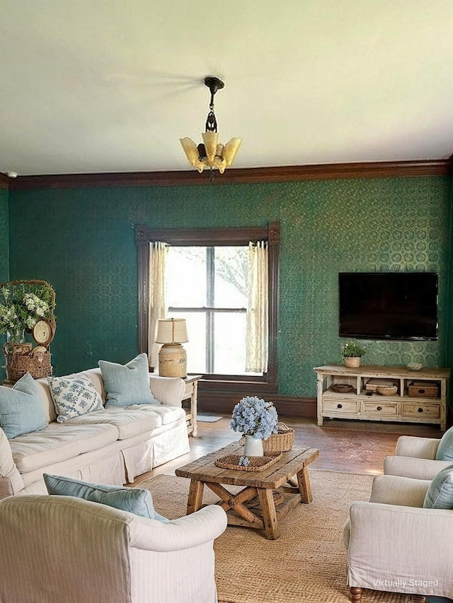living room featuring crown molding, wood finished floors, and wallpapered walls