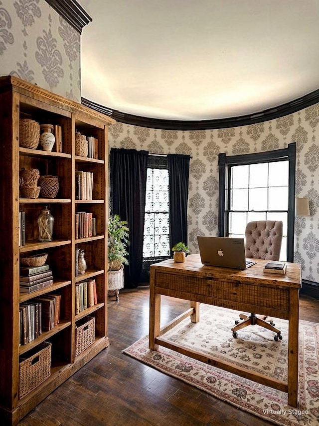 home office with wallpapered walls, plenty of natural light, and hardwood / wood-style flooring