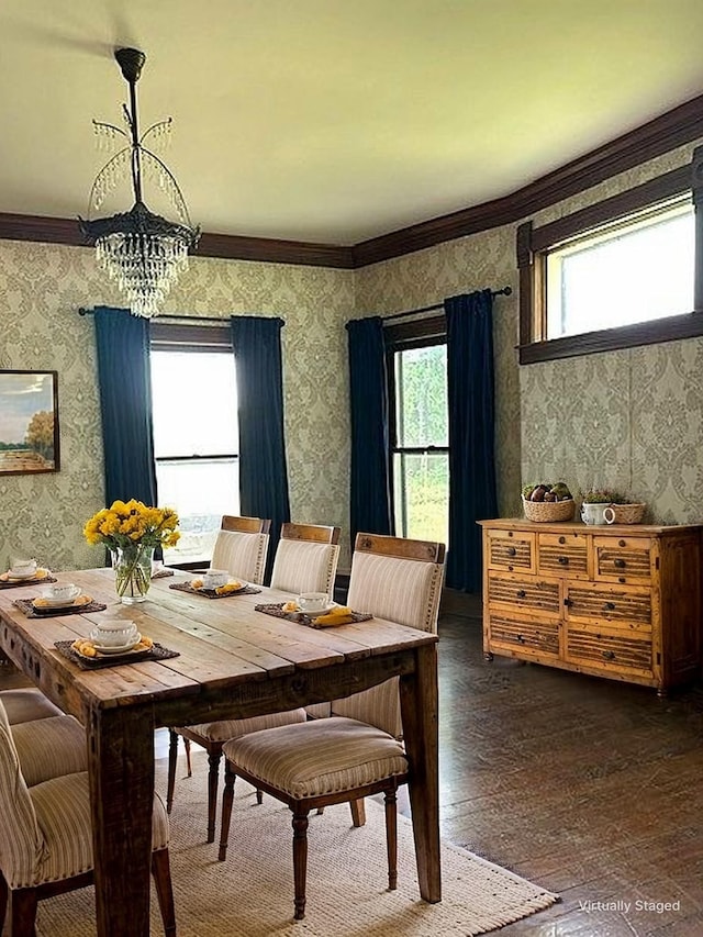 dining room with dark wood-type flooring, wallpapered walls, and a wealth of natural light