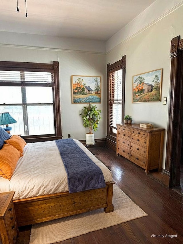 bedroom with wood finished floors