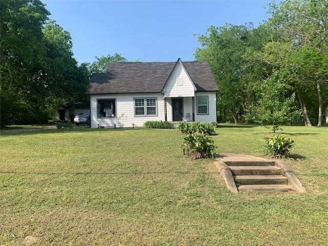view of front of home with a front lawn