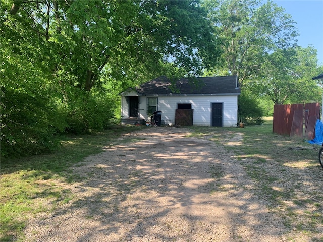 view of outbuilding featuring an outbuilding and driveway