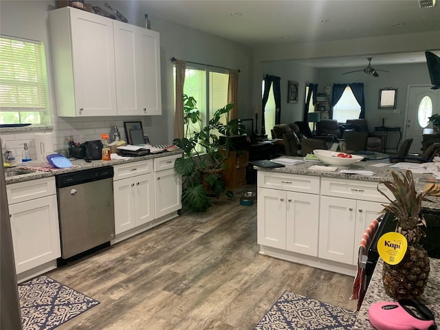 kitchen featuring white cabinets, dishwasher, and a ceiling fan