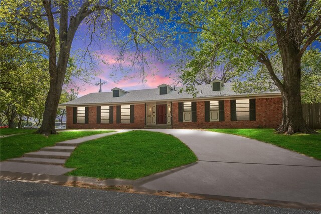 800 Western Hills Dr, Sherman, TX 75092 - ranch-style house with a front yard and brick siding
