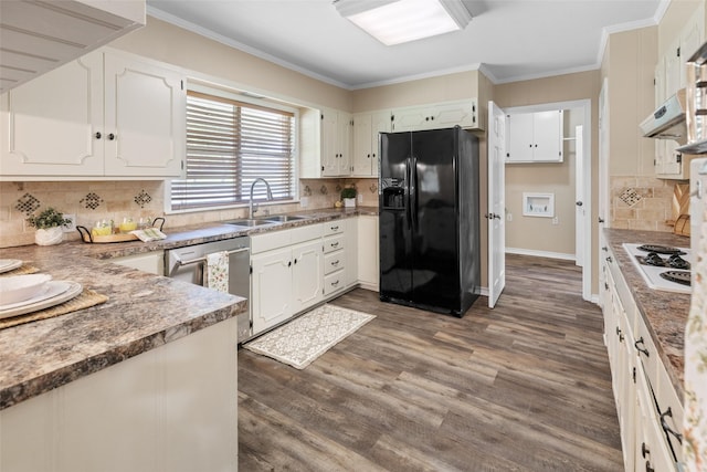 800 Western Hills Dr, Sherman, TX 75092 - kitchen with white cooktop, black fridge, backsplash, stainless steel dishwasher, and a sink