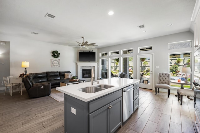 kitchen with gray cabinets, light countertops, a ceiling fan, visible vents, and dishwasher