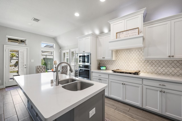 2616 Lazy Dog Ln, Northlake, TX 76247 - kitchen with stainless steel appliances, a sink, backsplash, recessed lighting, and light wood finished floors