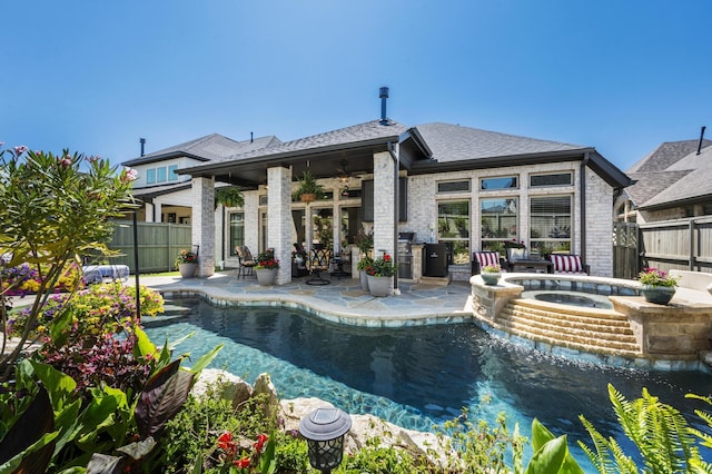 rear view of house featuring ceiling fan, fence, a patio, an in ground hot tub, and a fenced in pool