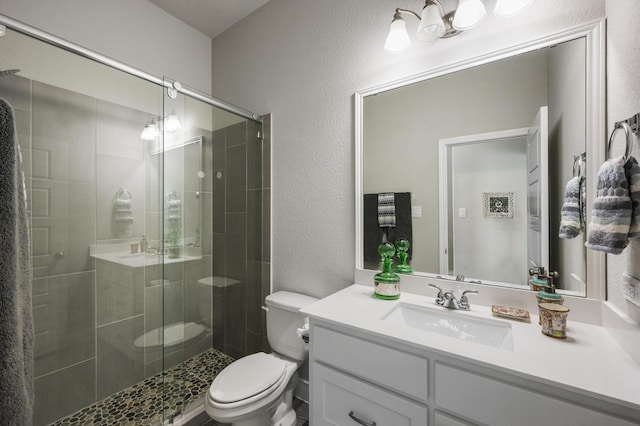 2616 Lazy Dog Ln, Northlake, TX 76247 - bathroom with toilet, a textured wall, vanity, and a shower stall