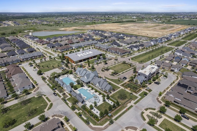 birds eye view of property featuring a residential view and a water view