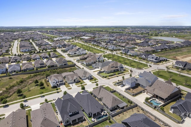 aerial view with a water view and a residential view