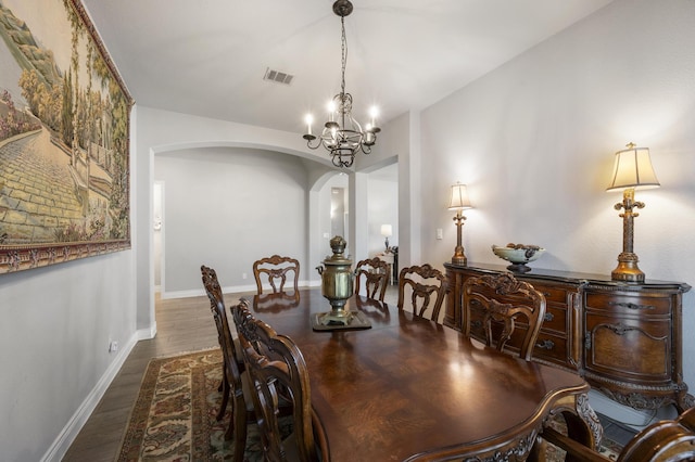 2616 Lazy Dog Ln, Northlake, TX 76247 - dining space with arched walkways, a chandelier, wood finished floors, and baseboards