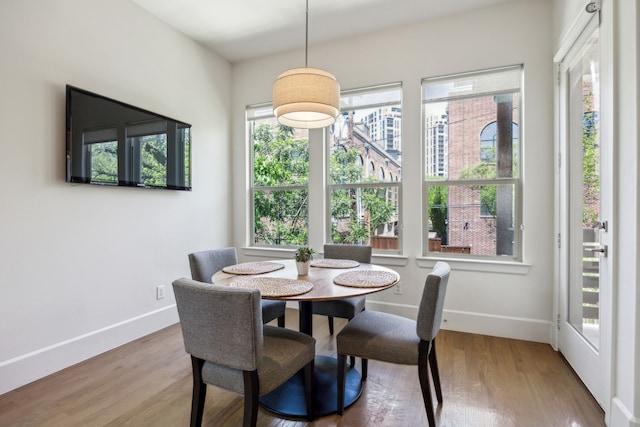 3912 Holland Ave, Dallas, TX 75219 - dining area with wood finished floors and baseboards