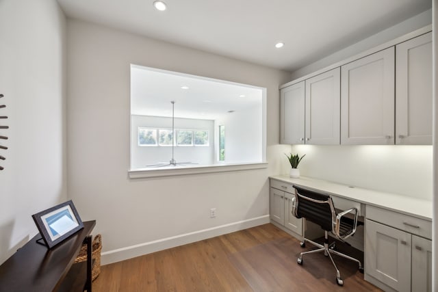 3912 Holland Ave, Dallas, TX 75219 - office area featuring built in desk, recessed lighting, wood finished floors, baseboards, and ceiling fan