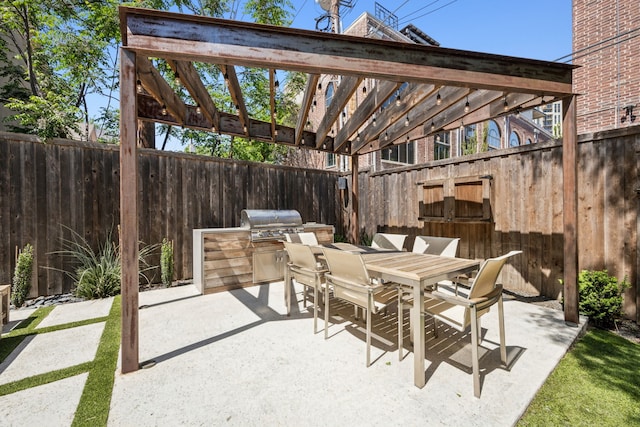 3912 Holland Ave, Dallas, TX 75219 - view of patio / terrace featuring an outdoor kitchen, a fenced backyard, a pergola, and grilling area