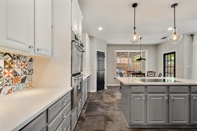 5800 Edgewood Dr, Mckinney, TX 75072 - kitchen with black electric stovetop, gray cabinets, light countertops, white cabinets, and decorative backsplash