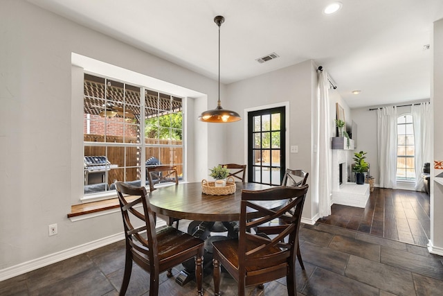 5800 Edgewood Dr, Mckinney, TX 75072 - dining room featuring visible vents, baseboards, and a healthy amount of sunlight
