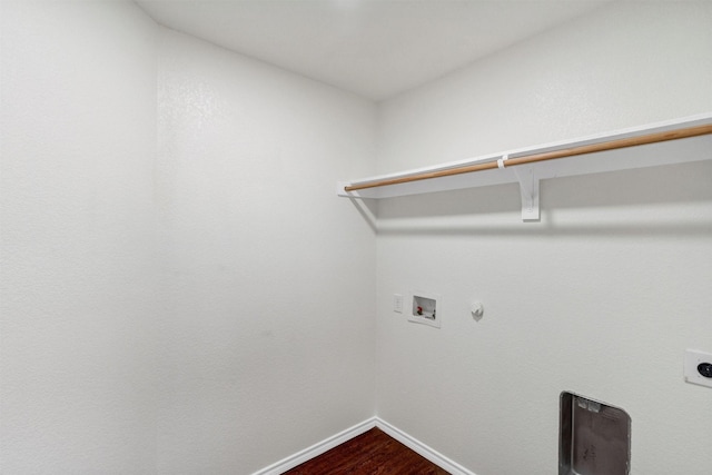 laundry area with hookup for an electric dryer, dark wood-style flooring, baseboards, washer hookup, and laundry area