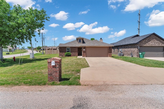 view of front of home featuring a front yard, brick siding, an attached garage, a shingled roof, and concrete driveway