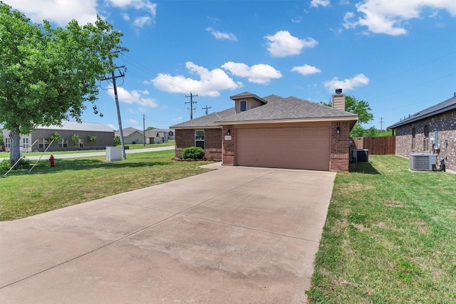 view of front of property featuring central AC, a garage, a chimney, brick siding, and a front lawn