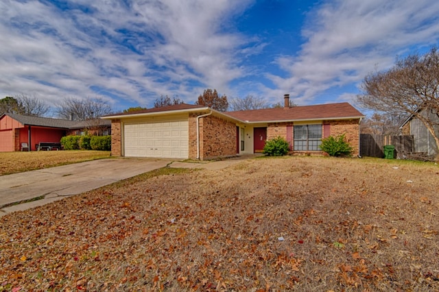 ranch-style home featuring concrete driveway, brick siding, and an attached garage